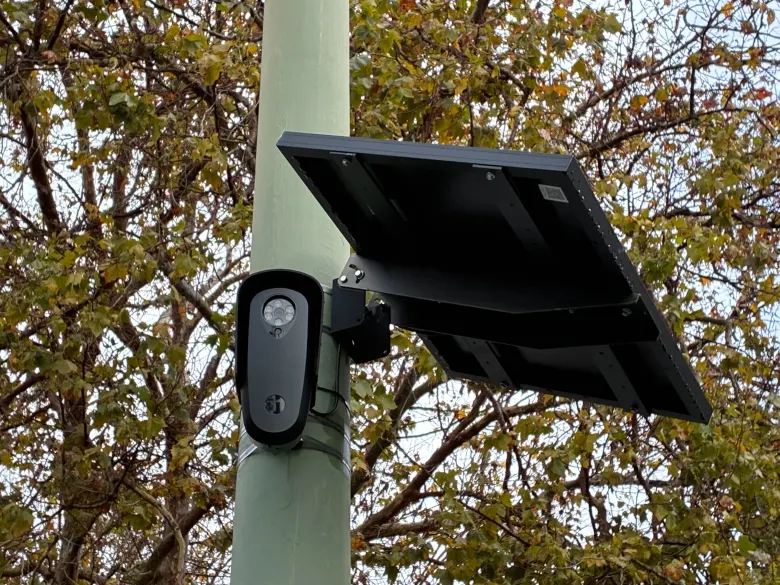 A Flock Safety license plate camera mounted on a pole